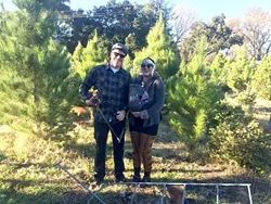 LET THE DOG SNIFF IT OUT: Scott and Rhiannon hadn’t yet picked out a tree—they said they’ll let their three-legged chihuahua, Lottie, pick it out. - PHOTO BY JONO KINKADE