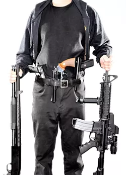 AND THE SCARY : Carbine (not his real name) has been fascinated by guns since childhood and frequently goes around armed even though he doesn’t have a CCW (concealed carry weapon) permit. In his early teens, he made a silencer for a handgun and used it to kill neighborhood cats, something he deeply regrets now. - PHOTO BY STEVE E. MILLER