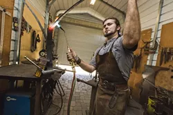 NERVES OF STEEL : Blacksmiths heat iron and steel to more than 2,700 degrees in order to make it malleable. - PHOTO BY KAORI FUNAHASHI