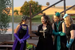 WHAT TIDINGS?: The princess of France (Heather MacLeod-Schultz, far left), eagerly listens to a piece of news brought by her de facto messenger Boyet (Janet Stipicevich, letter in hand) while fellow ladies in waiting Rosaline (Claire Harlan, second from right) and Katharine (Angela Hutt-Chamberlin, far right) listen in. - PHOTO BY STEVE E. MILLER