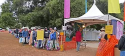 LINE UP! : Every morning, concertgoers line up to place their chairs at the main stage, reserving their spot for the day’s music line-up. - PHOTO BY GARY ROBERTSHAW