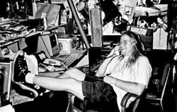 THEN:  Neal Losey kicks back in Cal Poly&rsquo;s student-run KCPR 91.3FM office in the early &rsquo;90s. - PHOTO COURTESY OF NEAL LOSEY