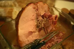 GOING, GOING, GONE : A spiral-cut ham gets devoured. - PHOTO BY GLEN STARKEY