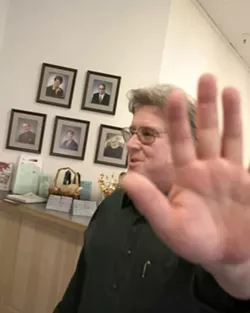ON FILM : Atascadero’s besieged redevelopment chief, Marty Tracey, was reprimanded for putting his hand in front of his face in a photo for an Oct. 27, 2005, New Times cover story. - FILE PHOTO BY CHRISTOPHER GARDNER