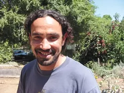 SEEING GREEN : Ahmed Fahmy, after years of attempts, received his green card status on Aug. 30. - PHOTO BY KYLIE MENDONCA