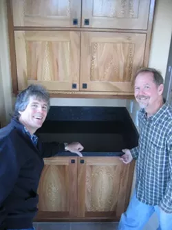 NATURES ART : Locally grown sycamore, a relative of maple, was used by cabinetmaker Clark Kluver (right) for the cabinets in the Arroyo Grande home of Mike Geringer (left). - PHOTO BY KATHY JOHNSTON
