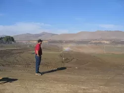 SOMEDAY SOON : Jim Stollberg, Union Asphalts vineyard manager, is preparing the land to be ready for a spring planting of grapevines. This is just one of several local projects being carried out to put used mining pits to good use. - BY KATHY JOHNSTON