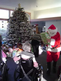 ORNAMENTATION : "Be a Santa to a Senior" Christmas trees around the county feature ornaments with the names and gift requests of needy seniors. - PHOTO COURTESY OF HOME INSTEAD SENIOR CARE