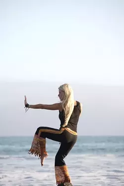 WORKOUT WISE : Nia instructor Calico Hauser offers body and nature friendly workouts at the beach. - PHOTO BY JESSE ACOSTA