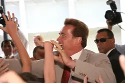 BIG MAN ON CAMPUS : Republican incumbent Arnold Schwarzenegger greets a lively crowd of supporters at his June 14 appearance at San Luis Obispo’s Sinsheimer Elementary. - PHOTO BY JESSE ACOSTA