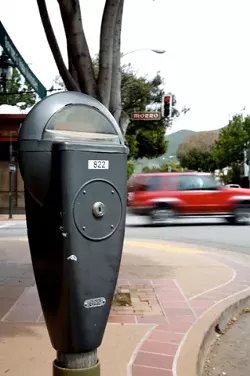 CHANGE, ANYONE? : Engineers are shuffling a couple of San Luis Obispo city parking meters on downtown streets as workers increase the size of parking spaces. - PHOTO BY JESSE ACOSTA