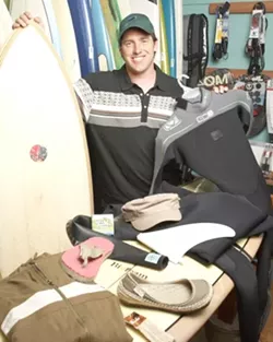 CHANGING THE WORLD : Ryan Milliman hopes that the Earth-friendly boards and more that he offers through the Shell Beach Surf Shop and the online Seahuggers will push the industry toward preserving the ocean. - PHOTO BY STEVE E. MILLER