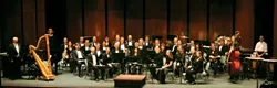 BLOW, BABY, BLOW : The SLO Wind Orchestra opens its 2007-'08 season with a multi-faceted concert on Oct. 20 in the Trinity United Methodist Church in Los Osos. - PHOTO COURTESY OF SLO WIND ORCHESTRA
