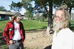 JUST VISITING : Tony Day (left) and Michael F. Gaither (right) say that they've taken shelter in Meadow Park on rainy nights in the past, and they often hang out there during the day, but they don't camp there. - PHOTO BY STEVE E. MILLER