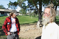 JUST VISITING :  Tony Day (left) and Michael F. Gaither (right) say that they've taken shelter in Meadow Park on rainy nights in the past, and they often hang out there during the day, but they don't camp there. - PHOTO BY STEVE E. MILLER