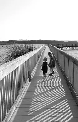 YOUNG EXPLORERS : *****strokes-book-8/3***** - Valerie and Erica Best helped gather research for Best Family Adventures: San Luis Obispo County by taking a stroll on the Oso Flaco Lake boardwalk. - PHOTO COURTESY OF JENNIFER BEST