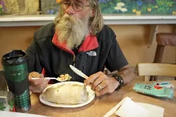 Once when Mike was quite hungry, he was met with generosity and kindness at Chili Peppers, so each month when he gets his disability check he goes to eat at the restaurant. Shrimp burritos and fish tacos are his favorite. - PHOTO BY STEVE E. MILLER