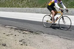 CRACKING ASPHALT: An example of the faulty bike lane along highway 1. - BY CHRISTOPHER GARDNER