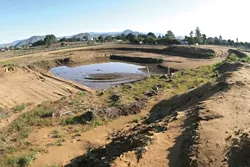 FUTURE SWIMMING POOL?: Like the Phoenix rising from the ashes, a new Los Osos park could ascend from the post-sewer rubble now known as the Tri-W site, but don’t get too excited — the plans are still embryonic. - PHOTO BY CHRISTOPHER GARDNER