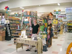 BOTANICAL BLISS : Caroline Duell happily doles out samples of “Good Goop,� an herbal healing balm. - PHOTO COURTESY OF CAROLIE DUELL