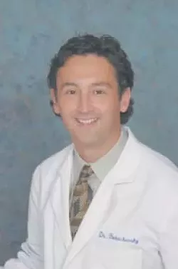 FACE TO FACE: Dr. Roman Bukachevsky volunteers his time and expertise as a plastic surgeon to help victims of domestic abuse.