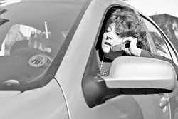 ENJOY IT WHILE YOU CAN : Santa Maria Sun editor Renee Haines helps demonstrate new laws for 2008. Habitual cell-phone users now have six months to find a hands-free device for use while driving. As of July 1, drivers who talk on a wireless telephone without a hands-free device while driving will be breaking the law. And watch that second-hand smoke. As of Jan. 1, it's illegal to light up with a minor in the car. - PHOTO ILLUSTRATION BY STEVE E. MILLER