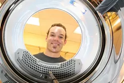 MISTER CLEAN : The future is bright and shiny for Nate Miller, owner of “Fresh Threads� full service launderia. - PHOTO BY CHRISTOPHER GARDNER