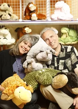 PETS YOU NEVER HAVE TO FEED : Anita Halcyon (pictured with her husband, Dave Karpowicz) owns Anita's Pillow Pets, which sells functional stuffed animals. - PHOTO BY STEVE E. MILLER