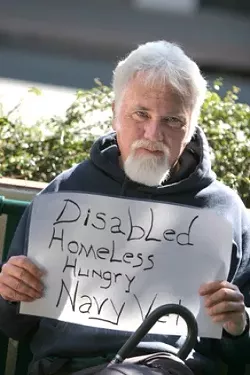 BENCH TIME : Homeless Navy veteran Patrick Walker agrees aggressive panhandling is wrong. “I’m not a piece of furniture, I’d hate to be removed. It’s a public bench on public property and I’m still a part of society. Many of us spilled blood to be on this bench.� The proposed ordinances target transients, but it’s unclear how these new laws will affect the homeless population. - PHOTOS BY CHRISTOPHER GARDNER
