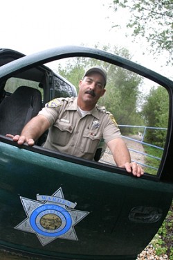 FISH PROTECTOR :  Fish and Game Warden Todd Tognazzini spends more and more time policing environmental crime. - PHOTOS BY CHRISTOPHER GARDNER