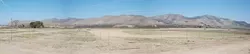 THE LONG VIEW : This barren land will soon be transformed into a thriving vineyard with a mix of Pinot Noir, Pinot Gris, and Viognier grapes. Union Asphalt plans to start planting the former mining basin this spring. - BY KATHY JOHNSTON