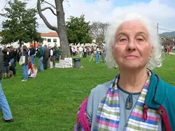 EXPERIENCED ACTIVIST : Pat Miller, who claims founding membership in Mothers for Peace as part of her long history of activism, has seen a lot of protests and rallies over the years. The 80-year-old still tries to show up at events, but knows many fellow activists who can not because of age or fatigue. - PHOTO BY RYAN MILLER