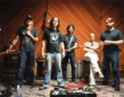 MELON HEADS UNITE : Travis Warren (center), shown here with Blind Melon for whom he now sings, plays a solo acoustic set along with three other local frontmen, on April 17 at Downtown Brew as part of a new series: Grassroots Tuesdays. - PHOTO COURTESY OF BLIND MELON