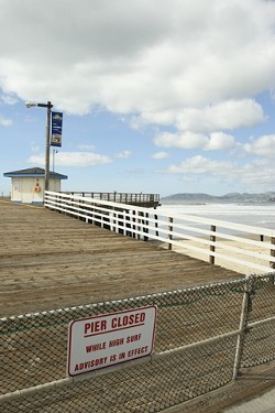 DON'T WALK ON WATER :  Recent heavy swells prompted the closure of the Pismo Beach pier. - PHOTO BY STEVE E. MILLER