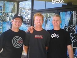 STOKED ON THEIR STOREFRONT :  Anthony Randazzo Jr., Nathan Ditmore, and Tim Cowan pose in front of the future location of San Luis Surf Co., at the corner of Morro and Higuera. - PHOTO COURTESY OF SAN LUIS SURF CO.
