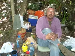 ALONG THE WAY : While Staff Writer Kai Beech walked along San Luis Obispo Creek, he met Eric Olson, pictured, who left San Diego for the relative safety of San Luis Obispo. - PHOTO BY KAI BEECH