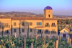 A GROWING INDUSTRY: A recent study measuring the economic impacts of SLO County’s wine industry looks at the economic output from vineyard production to tourism and retail sales. The Allegretto Vineyard Resort (pictured) in east Paso Robles is one of the more recent hotels that’s sprouted up with the booming industry. - PHOTO COURTESY OF ALLEGRETTO VINEYARD RESORT