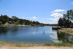 WHODUNIT?: A substance believed to be “pond dye” was discharged into Atascadero Lake on April 18, turning the lake bright blue. The color has diminished since, but the California Department of Fish and Wildlife is still investigating who did it and if the solution was toxic. - PHOTO BY DYLAN HONEA-BAUMANN
