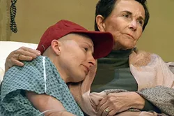 DEATH, BE NOT PROUD: Vivian Bearing (Megan C.C. Walker) is comforted in the hospital by her one and only visitor, her former mentor and professor E.M. Ashford (Rosh Wright). - PHOTOS COURTESY OF JAMIE FOSTER PHOTOGRAPHY
