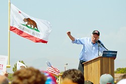 CALIFORNIA DREAMIN':  Democratic presidential candidate Sen. Bernie Sanders spoke to a packed crowd in Santa Maria. In the middle of his speech, he began feeling the burn coming on and put on a Santa Maria High School hat. - PHOTO BY JOE PAYNE