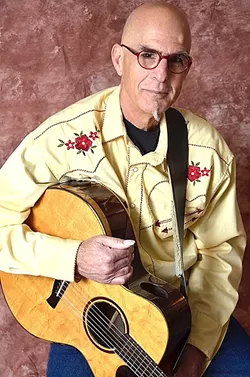 GUITAR MASTER: Blues guitarist Dorian Michael is one of 45 performers and groups playing the 33rd annual Arroyo Grande Strawberry Festival on May 28 and 29. - PHOTO COURTESY OF DORIAN MICHAEL