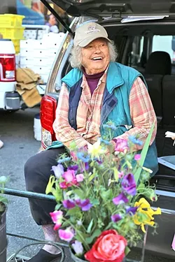 IN BLOOM: Ruth “The Flower Lady” Scovell of Orchard to You Farm in Atascadero has been selling at the Downtown SLO Farmers’ Market for the past 36 years. - PHOTO BY DYLAN HONEA-BAUMANN