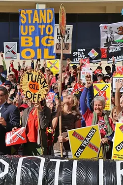 SHOUT IT OUT LOUD: Protestors gather in front of the SLO County courthouse to rally against the Phillips 66 rail extension project. - PHOTO BY DYLAN HONEA-BAUMANN