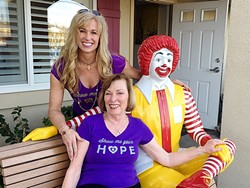 LAUGHTER AND SUPPORT :  Jenny Mulks Wieneke (standing) and Linda Mulks pose with Ronald McDonald at a charity event for the San Luis Obispo-based nonprofit Along Comes Hope. - PHOTO COURTESY OF JENNY MULKS WIENEKE