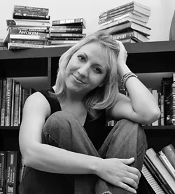 SO MANY BOOKS, SO LITTLE TIME : Sarah Noffke, a mom and author based in San Luis Obispo, multitasks by writing books on her phone while working out on the treadmill at the gym. Noffke has written 12 young adult fantasy and sci-fi novels in the past several years. - PHOTO COURTESY OF SARAH NOFFKE