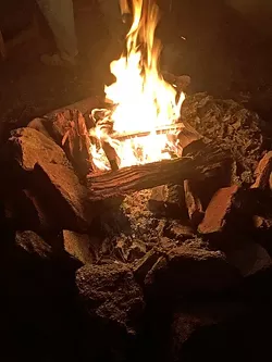 CAVEMAN TV: No men’s gathering would be complete without a campfire. - PHOTO BY GLEN STARKEY