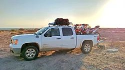 HERE COMES THE CALVARY: A team of 10 friends and family in five cars served as the team’s crew, meeting up with the four riders at various stops for fuel, repairs, and food. - PHOTO COURTESY OF COASTRIDERS POWERSPORTS