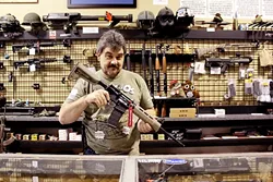 AR-15: This semi-automatic rifle—one of Tacti-Cool Guns’ best sellers—would become illegal under Assembly Bill 1135. - PHOTO BY BRENNA SWANSTON