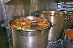 FOUNTAIN OF YOUTH?: Bones from grass-fed beef simmer for hours alongside nutritious veggies and aromatic spices to create a wholesome (and delicious) elixir. In an effort to keep up with overwhelming demand, The Wellness Kitchen in Templeton is currently looking for more local ranchers to donate or sell leftover bones. - PHOTO BY HAYLEY THOMAS