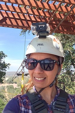 HERE WE GO:  New Times Arts Editor Ryah Cooley prepares to ride the Double Barrel, Margarita Adventure&rsquo;s newest and longest zip line at 2,800 feet. - PHOTO BY RYAH COOLEY